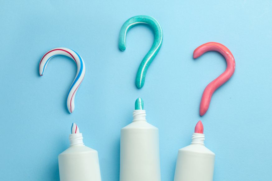 Three question marks made of toothpaste